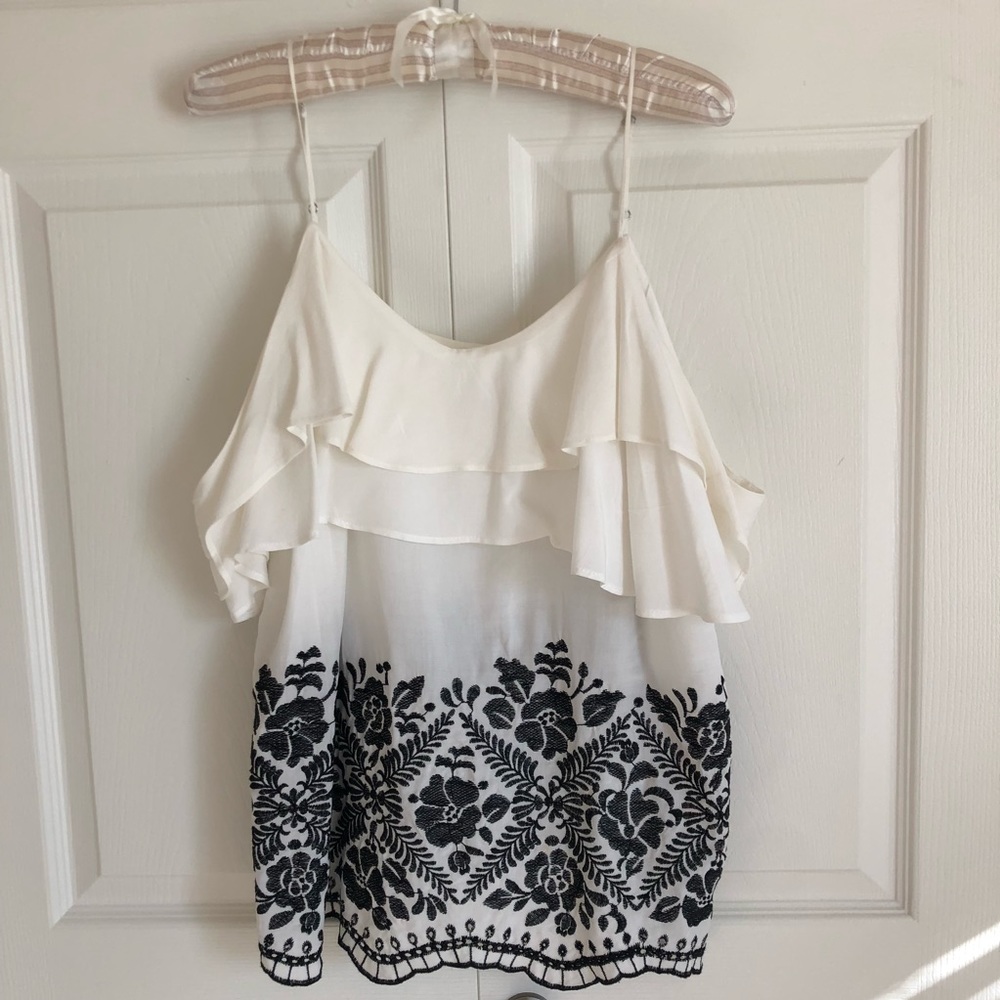 Beautiful white strappy blouse w/ shoulder accent